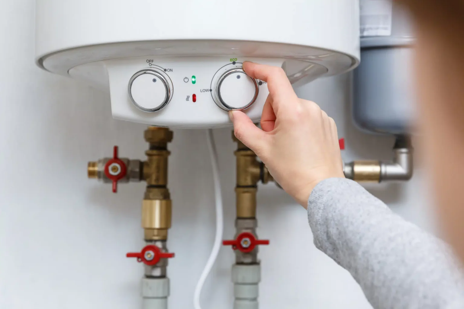Technician adjusting a water heater in Lawndale